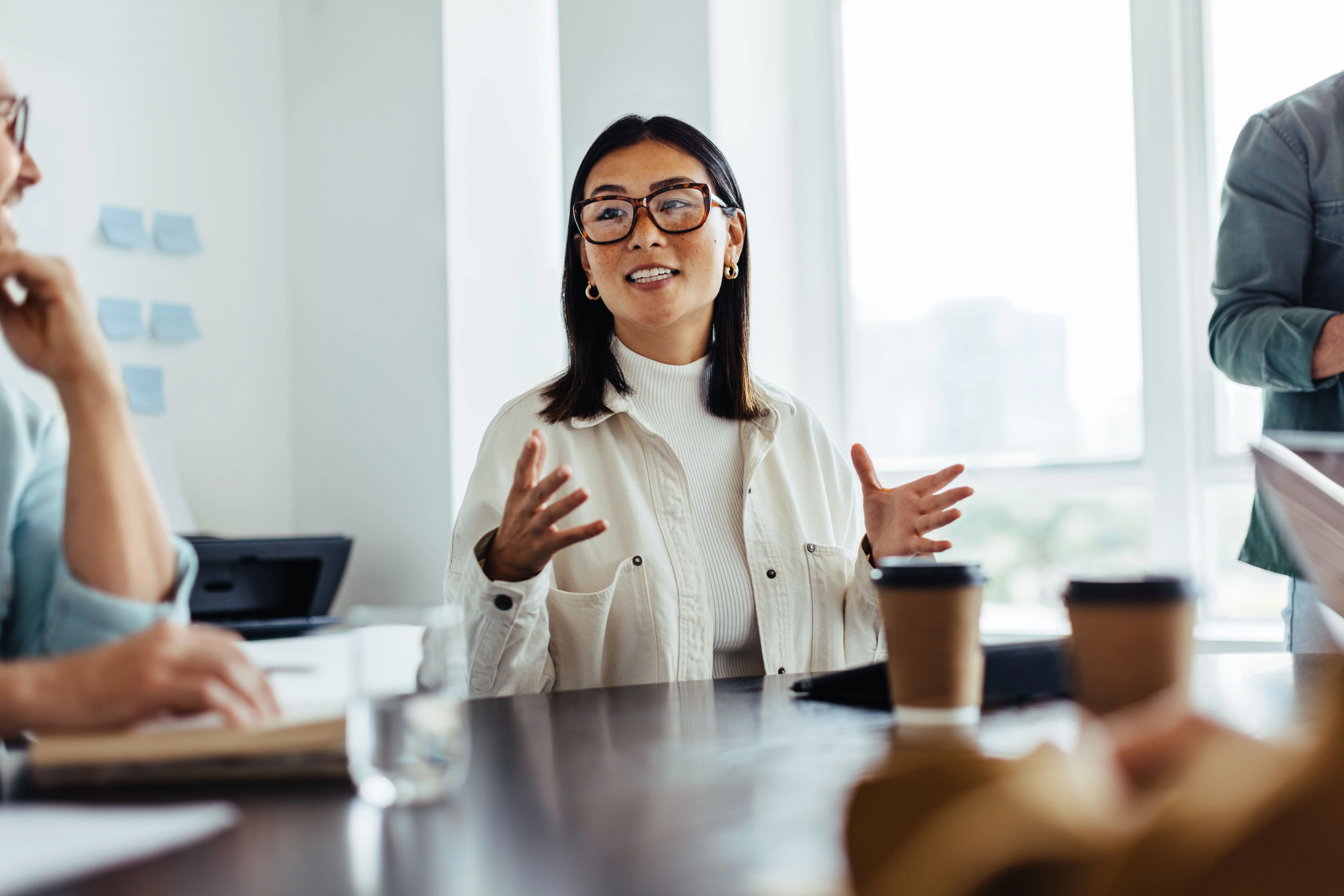 Woman in a conference room negotiating with confidence